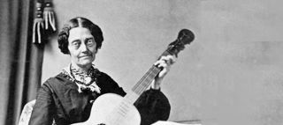 Fotografi som visar Josabeth med sin gitarr
