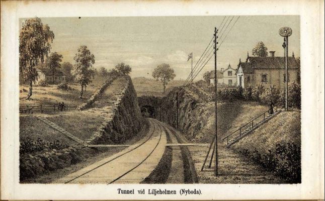 Järnvägstunnel, hus och träd på ömse sidor
