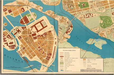 Tryckt karta i färg, med kvarter i ljusbrunt, obebyggda ytor  i ljusgrönt, parker i grönt, gatunät i beige, vatten i blått