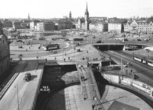 Vy över Södermalmstorg och Slussens trafikmaskin mot Gamla Stan