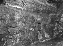 Murad vägg av natursten i Storkyrkobrinken. Fotograferad vid en arkeologisk undersökning.