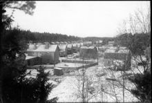 Olovslunds småstugeområde i kvarteret Gökuret under byggnad. Vintertid