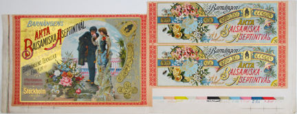 Etikett till tvålkartong tryckt i flera färger. Topp- samt sidostycken. Man kysser kvinna på handen. Medaljonger och blomsterkransar samt text.