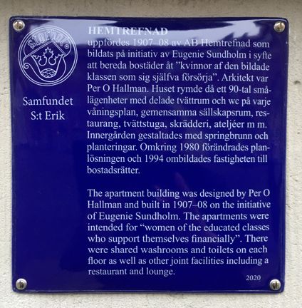 Blå emaljerad skylt med vit text