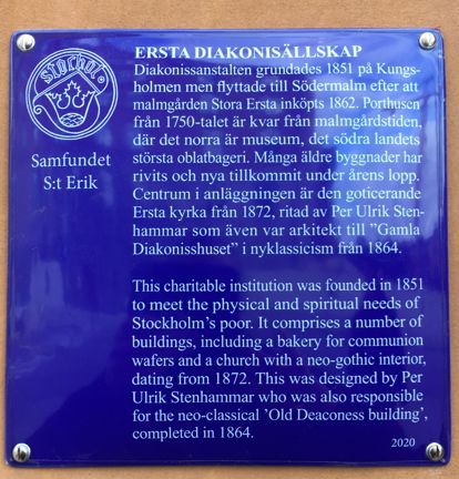 Blå emaljerad skylt med vit text